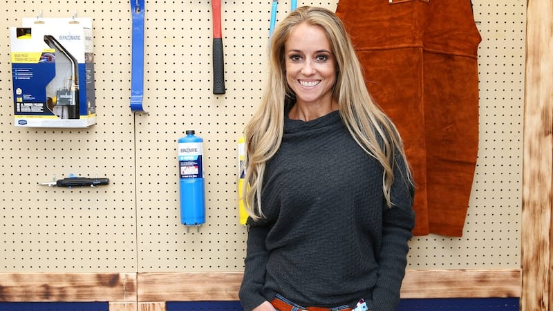Nicole Curtis poses inside the Bernzomatic tent at World Maker Faire on Saturday, October 1,...
