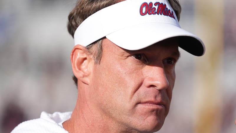 Mississippi head coach Lane Kiffin looks out over the playing field following his team's win...