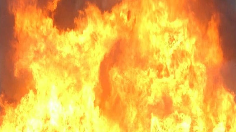 Barn fire spreads to house, forces crews to shut down road